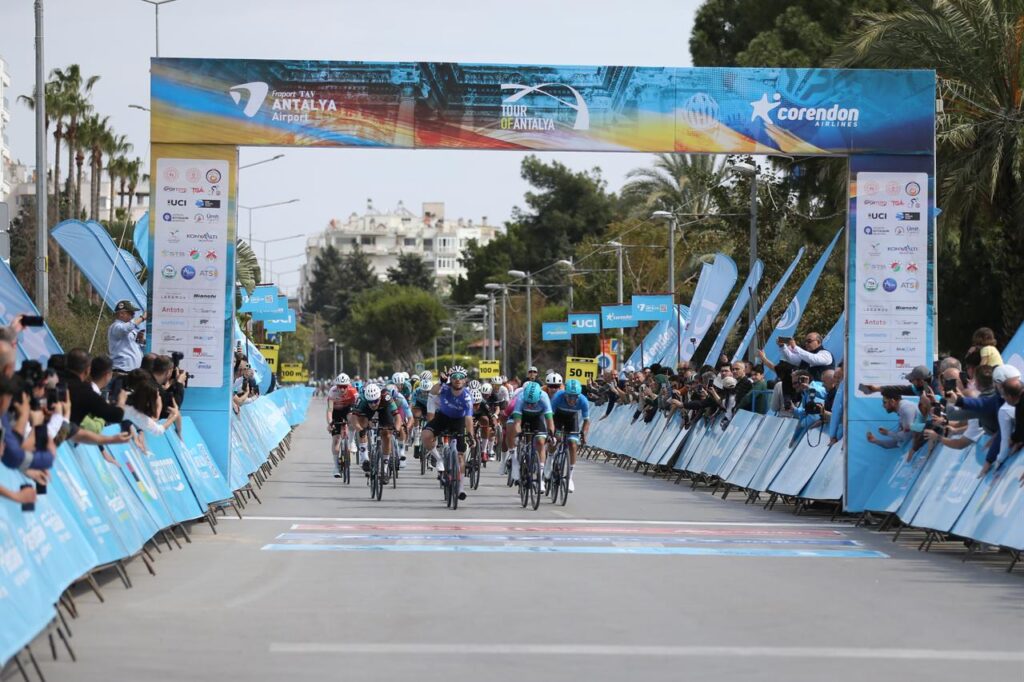 Riders approach the finish line beneath the Tour of Antalya banner during the final stage of the race in Antalya, Türkiye, March 15, 2026. (AA Photo)