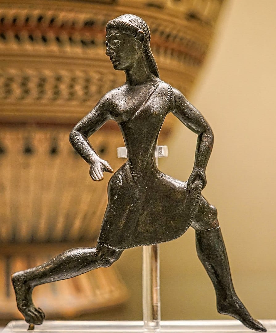 Bronze figure of a running girl wearing short chiton baring one breast
