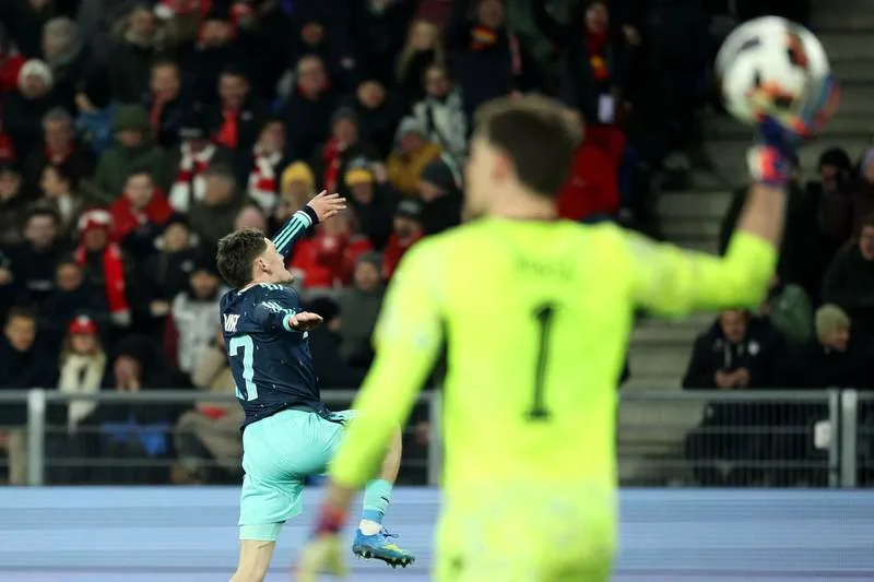 Germany's Florian Wirtz (L) celebrates his side's fourth goal of the game during the International Friendly soccer match between Switzerland and Germany at St. Jakob Park. Christian Charisius/dpa