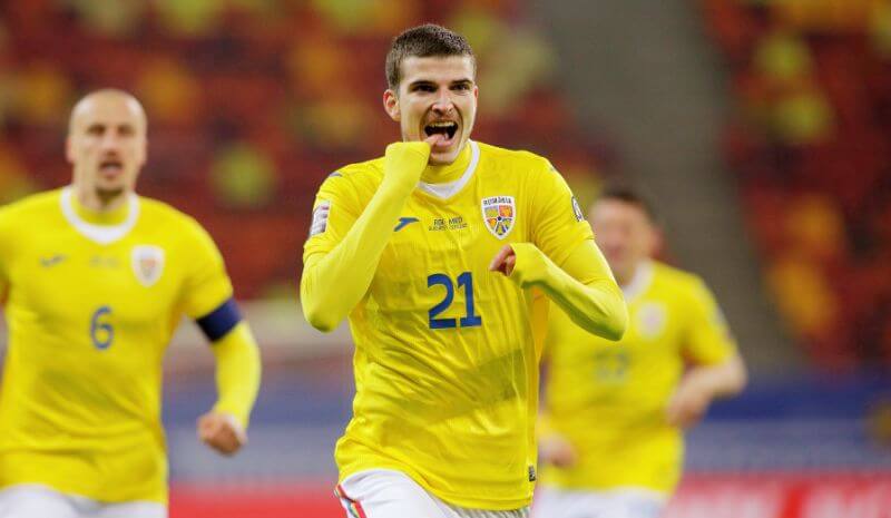 Romania's Valentin Mihaila celebrates scoring their second goal.