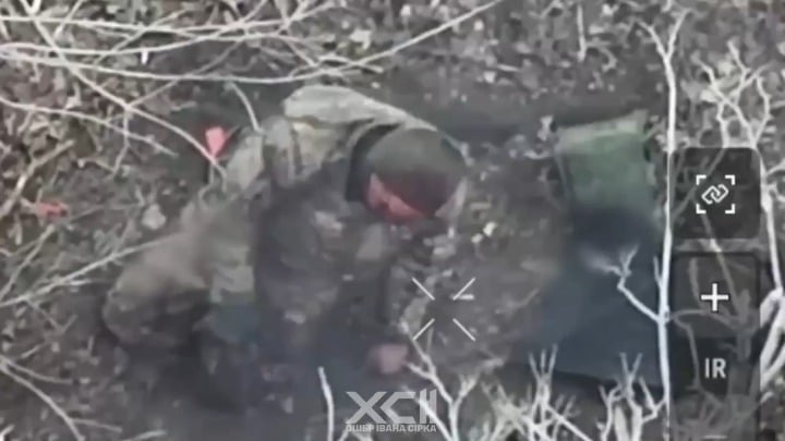 A wounded russian soldier kneeling on the ground aims his rifle at his temple and pulls the trigger. 92nd Bde, March 2026