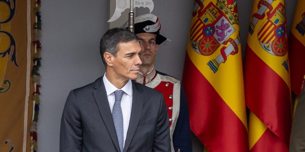 Spain's Sanchez rises above the bowed heads of Europe