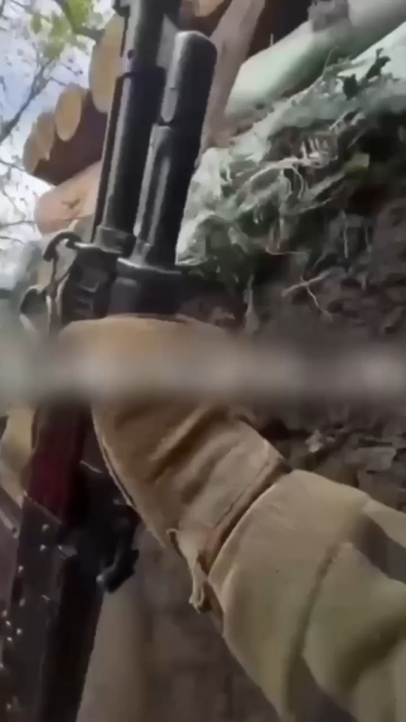 POV explosion (drone or artillery) hits a Ukrainian trench causing a grisly arm and hand injury. Unknown location and date.