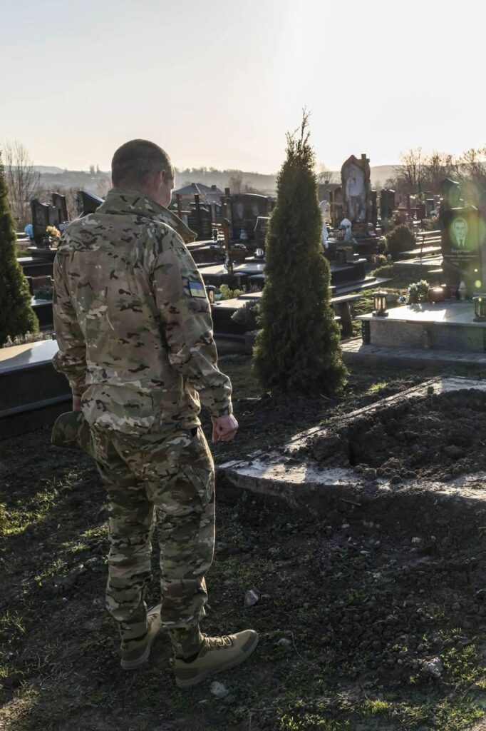 Ukrainian soldier Nazar Daletsky, who had long been presumed dead, looks at his own grave after nearly four years in captivity.