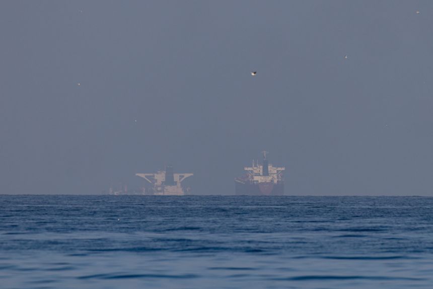 Commercial vessels in the Gulf, near the Strait of Hormuz in northern Ras al Khaimah, United Arab Emirates on March 22, 2026.