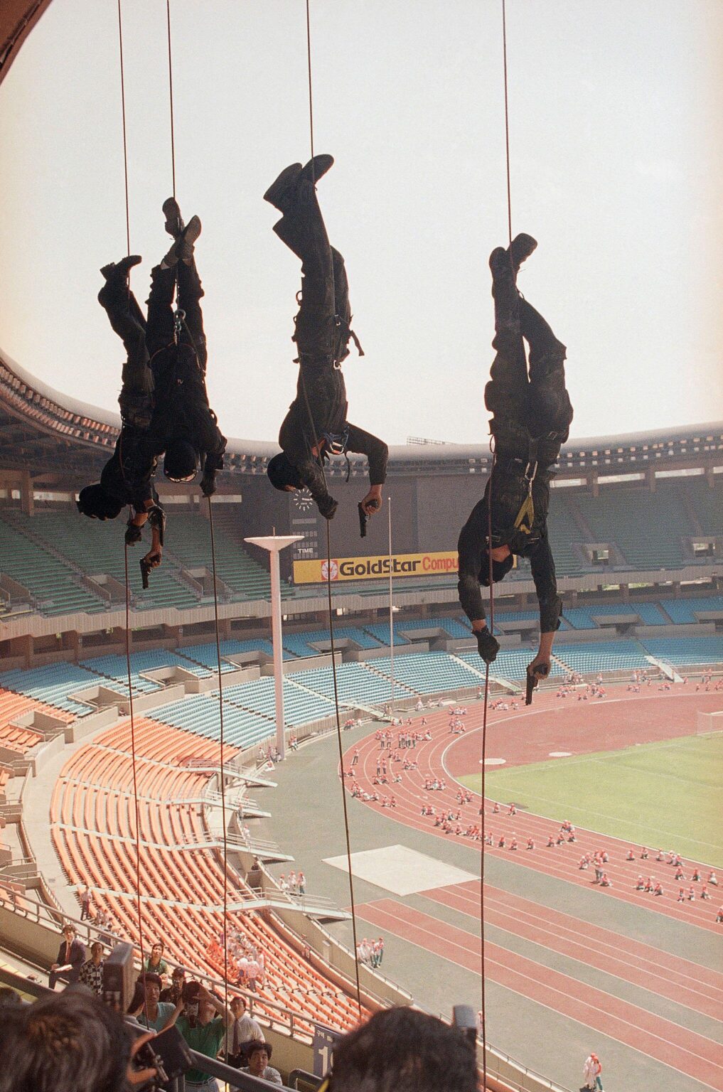 South Korean anti-terrorist commandos sliding down ropes with guns drawn during a training exercise in the main Olympic Stadium ahead of the 1988 Summer Olympics in Seoul, South Korea. [2034×3072]