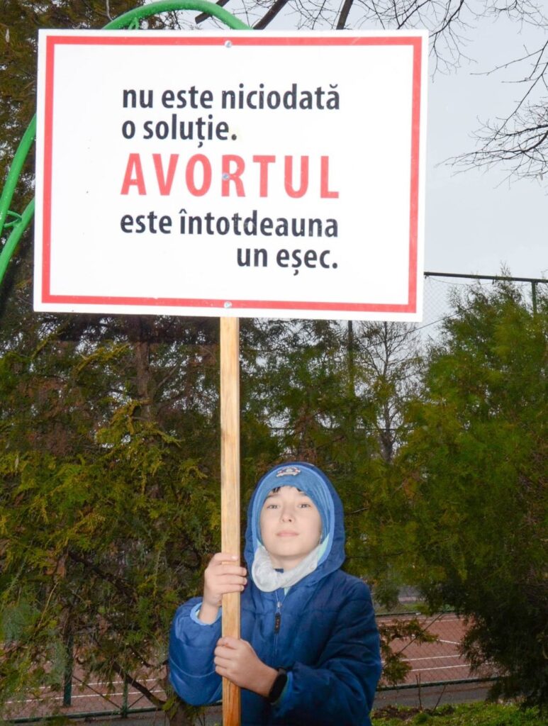 Do the children in these images know what 'conception' or 'abortion' means?