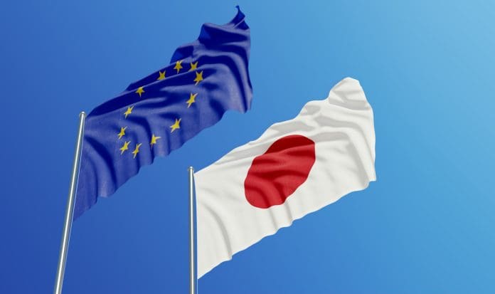 European Union and Japanese Flags Waving With Wind