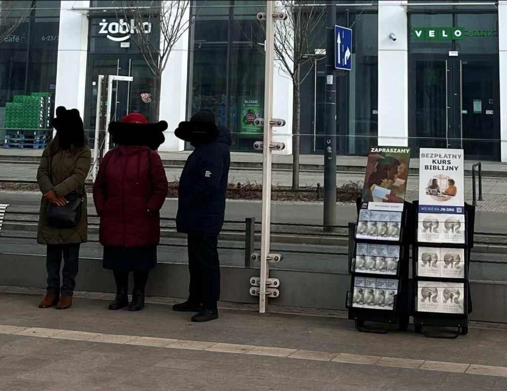 Will someone tell me: who are these people?; are they paid?; in how many Polish cities can you find them?