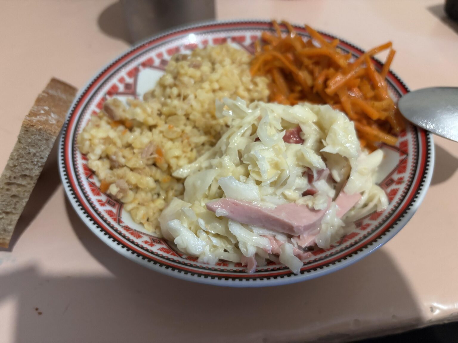 Dinner time in my military unit somewhere Ukraine: bulgur with meat, cabbage salad with boiled sausage, and Korean-style carrots