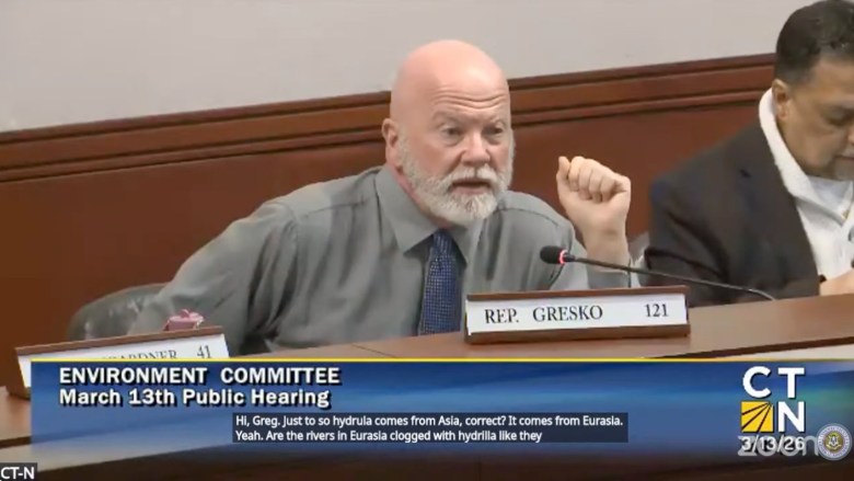 Rep. Gresko speaks into a microphone