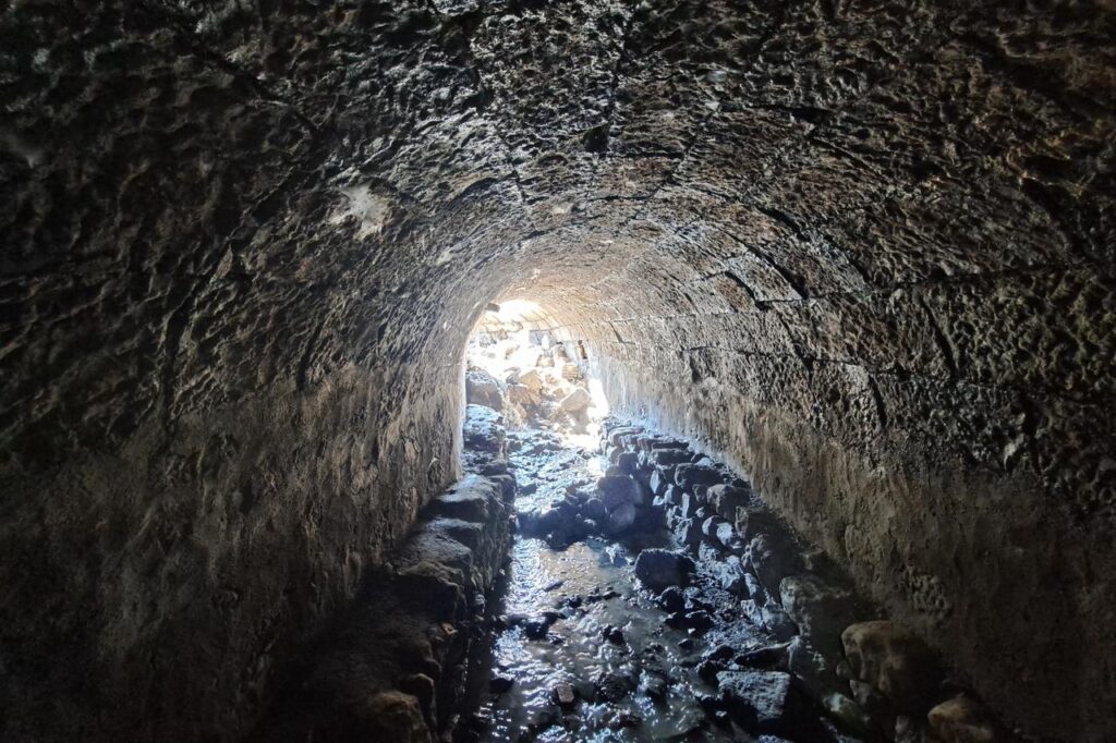 A vaulted underground water tunnel believed to date to the Roman period emerges during urban redevelopment works in Trabzon, Türkiye, March 4, 2026. (IHA Photo)