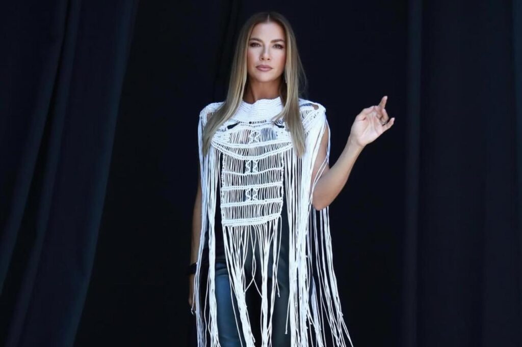 Ivana Sert poses in a fringed white outfit during a photoshoot, June 16, 2025. (Photo via Instagram/@ivanasert)
