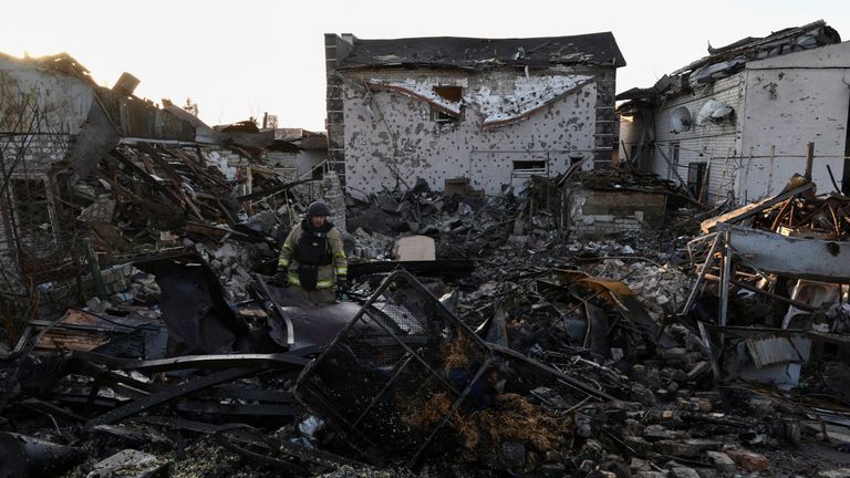 A firefighter inspects debris in Zaporizhzhia. Pic: Reuters