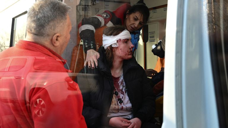 An injured resident receives first aid. Pic: Reuters