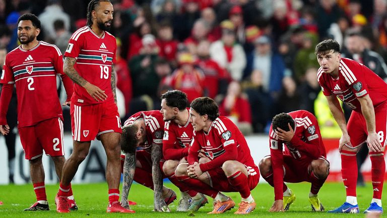 Wales' Harry Wilson (centre left) and team-mates react after losing the penalty shoot-out
