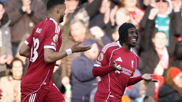 Jeremie Frimpong and Cody Gakpo celebrate Liverpool's fifth, an own goal scored by West Ham's Axel Disasi (not pictured)