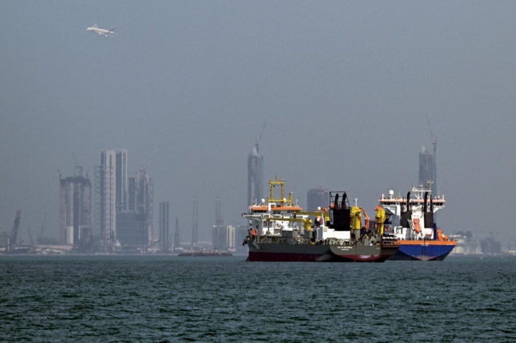 Commercial vessels are pictured offshore in Dubai, United Arab Emirates on March 11, 2026. (AFP Photo)