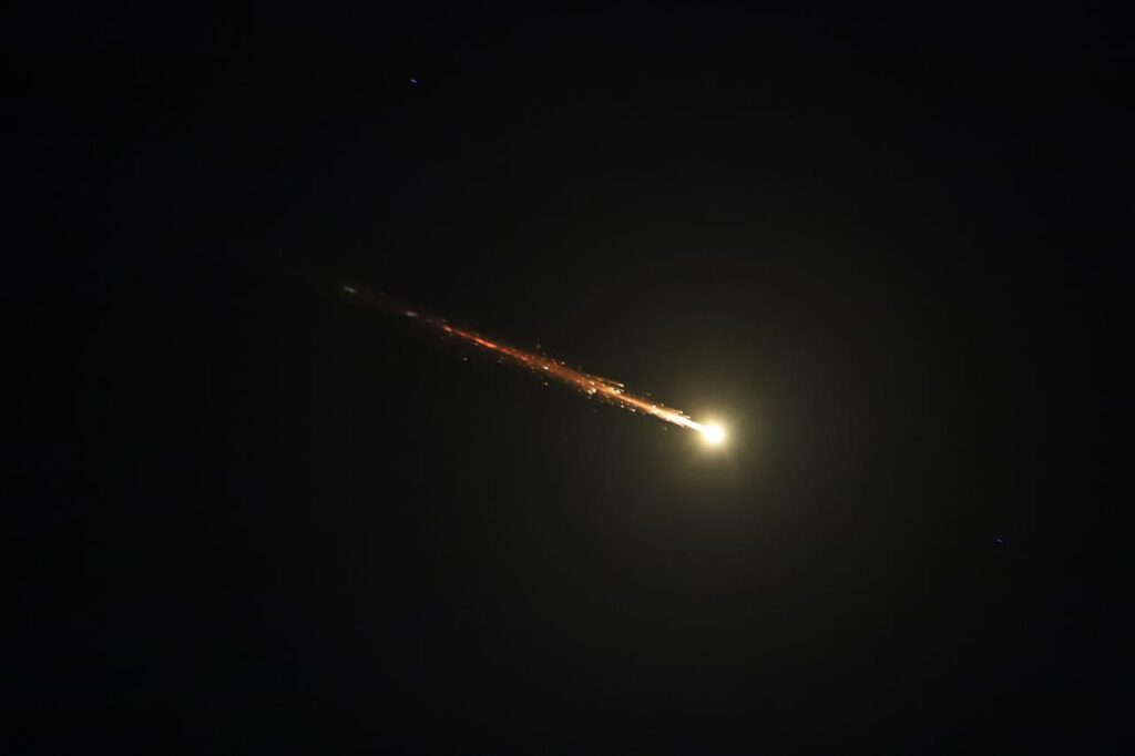 Iranian missiles launched toward Israel as part of retaliatory strikes following U.S. and Israeli attacks are seen in the sky over Hebron, West Bank, March 3, 2026. (AA Photo)