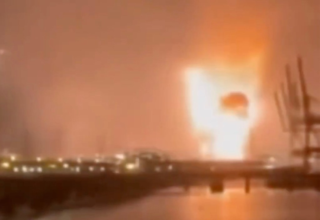 Nighttime photo of a massive fire and smoke at the Primorsk oil export hub.