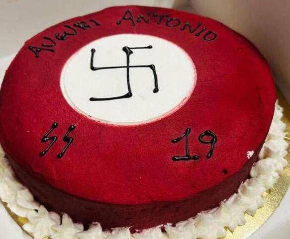 Swastika and SS symbol on a cake, storm on a pastry shop in Matera