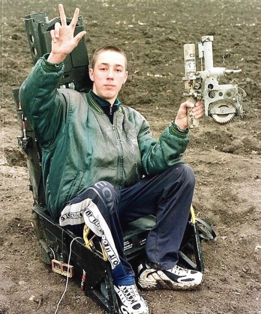 A Serbian boy posed in the ejection seat of an F-117 Nighthawk after it was shot down during the NATO bombing of Serbia in 1999.