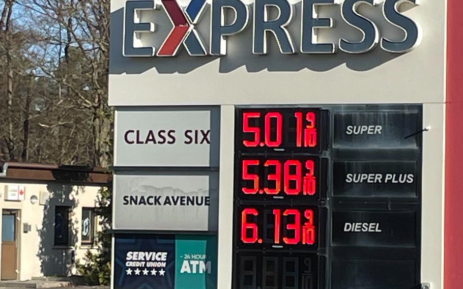 Gas prices are displayed on a digital sign.