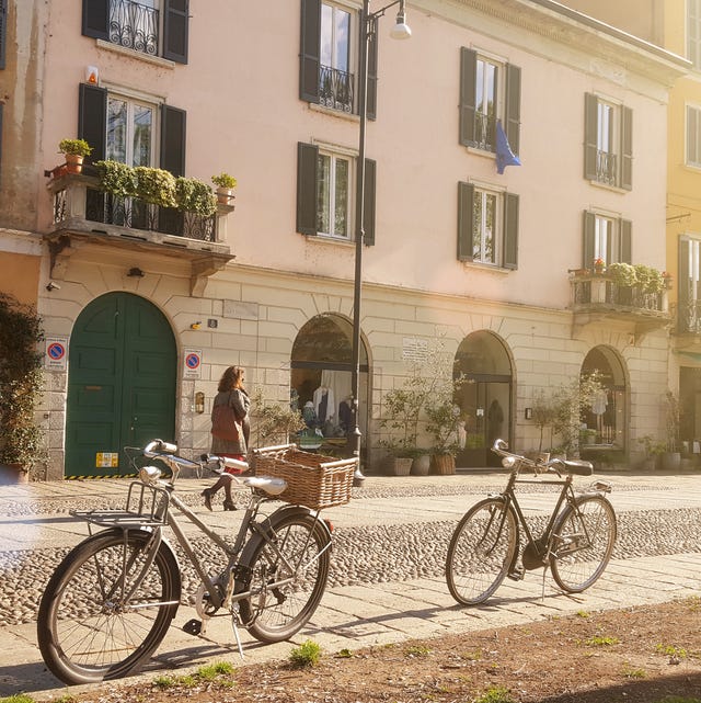 Old-fashioned bikes along Naviglio Grande, in Milan, Italy, in the morning