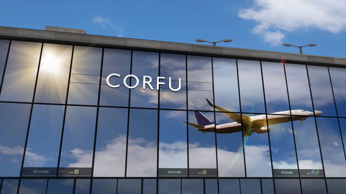 An aircraft in mid-flight is reflected on the glass façade of a modern building, prominently displaying the word "CORFU" amidst a blue sky with scattered clouds.