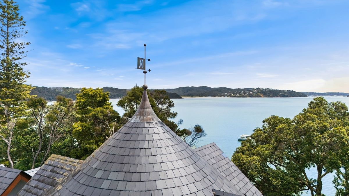 The turret's metal finial is a direct visual link to Castell Coch at a House in New Zealand in the Bay of Islands for sale design based on Castell Coch and called Castell Bach with agent Mackys Real Estate part of Bayleys Realty Group for over $3m New Zealand dollars