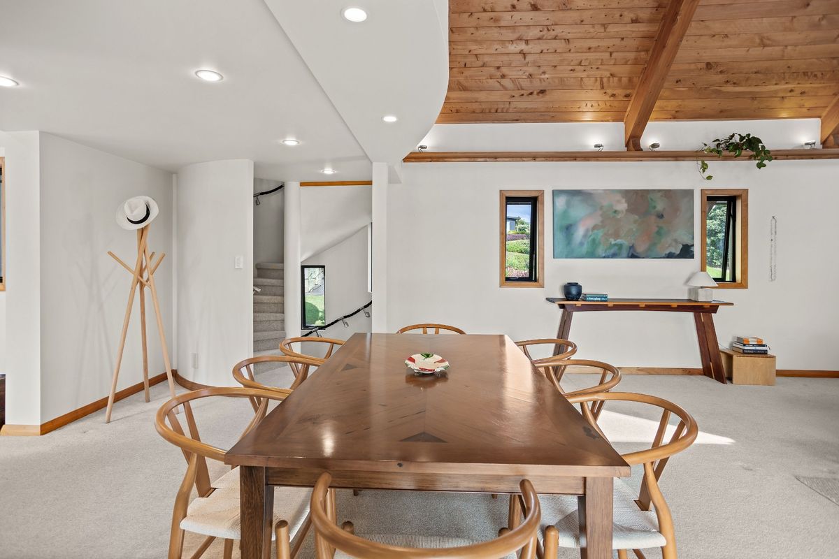 Dining area with castle-style slit windows at a House in New Zealand in the Bay of Islands for sale design based on Castell Coch and called Castell Bach with agent Mackys Real Estate part of Bayleys Realty Group for over $3m New Zealand dollars