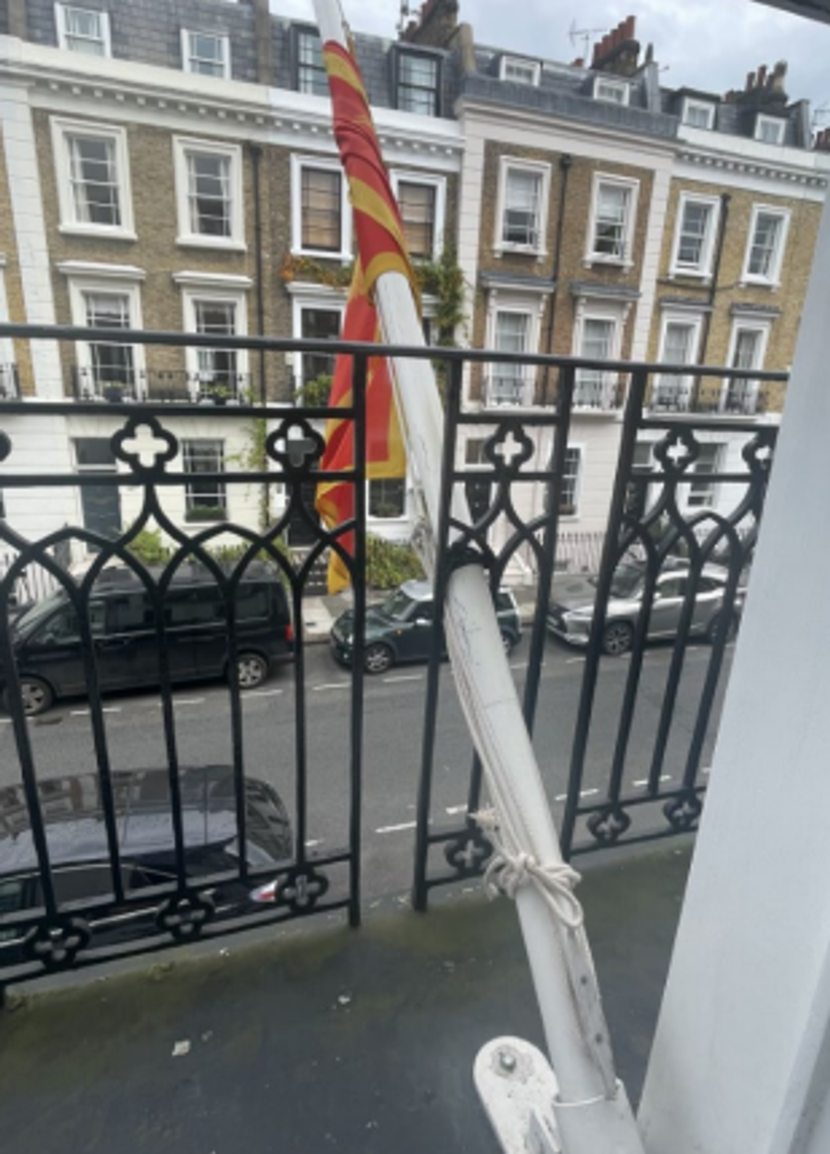 Flag displayed from one of the house's windows