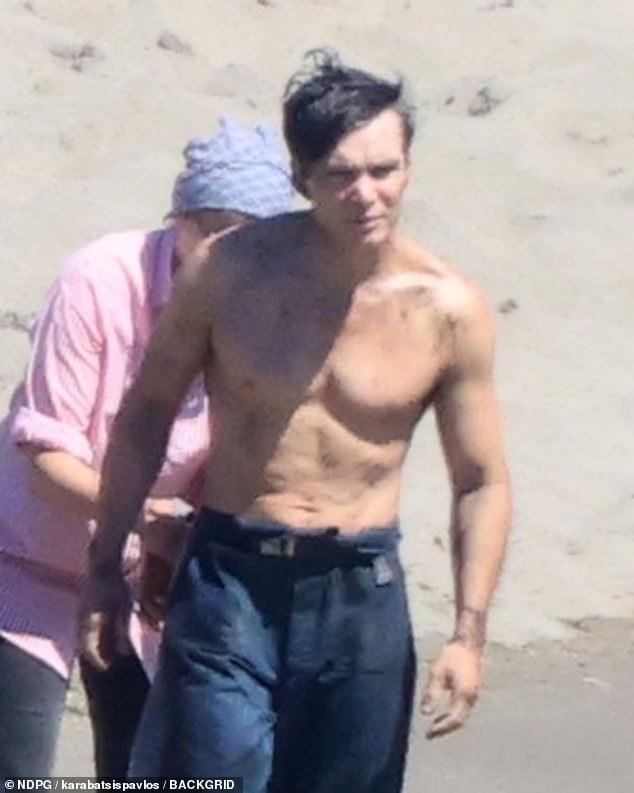 Cillian showed off his chiselled abs as he went shirtless while filming intense scenes knee-deep in the sea beside a dramatic shipwreck on Friday