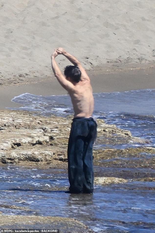 Cillian looked to be stretching in another shot as he appeared shirtless