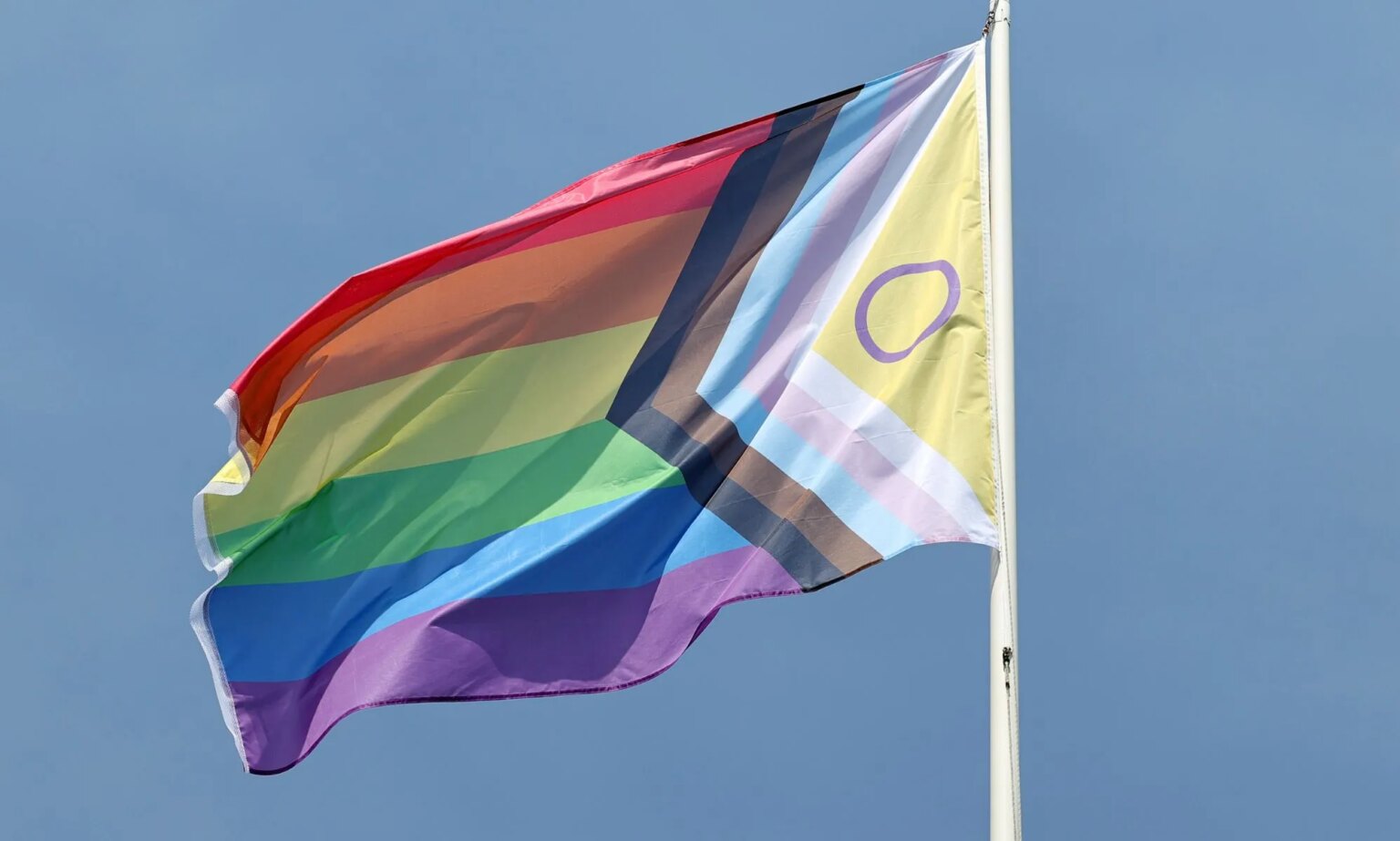 Belarus approves new law targeting ‘LGBTQ+ expression’ A Progress Pride flag on a flagpole.