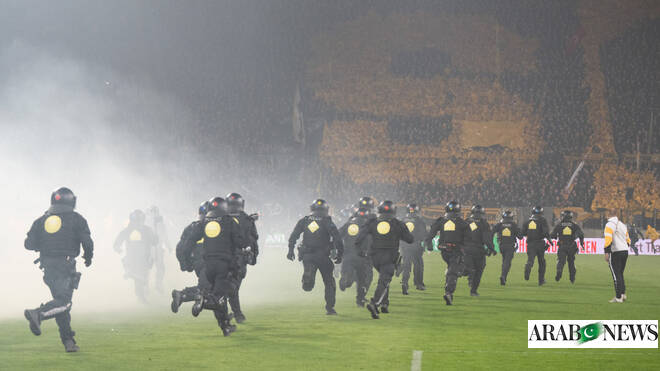 Police chase fans off the field in clashes at German club game in Dresden Police chase fans off the field in clashes at German club game in Dresden