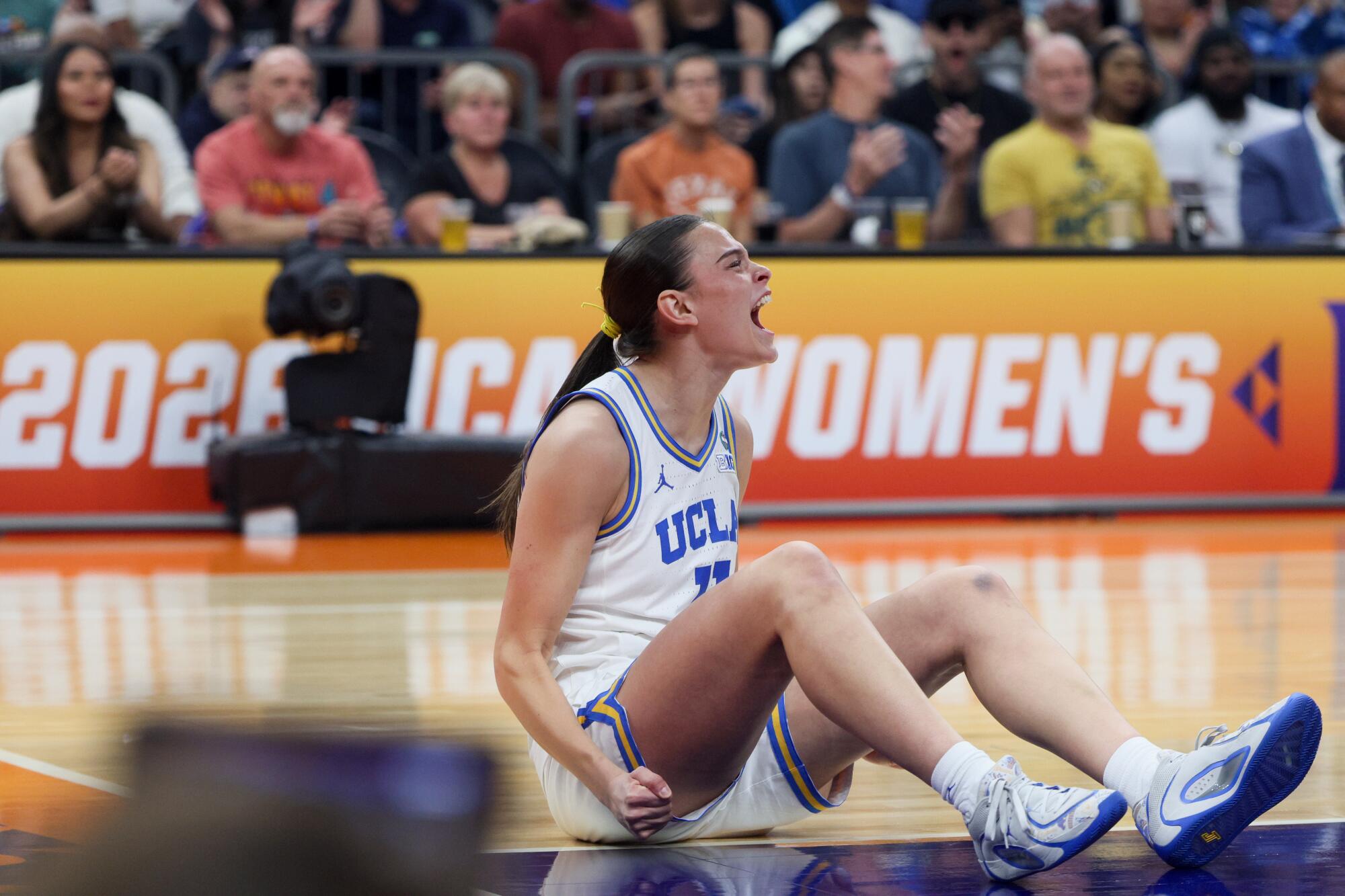 UCLA's Gabriela Jaquez celebrates after scoring while being fouled during the first quarter Sunday.