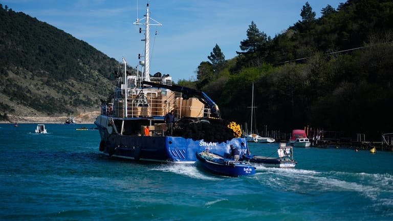 Fishermen depart for fishing from the port of Plomin, Croatia,...