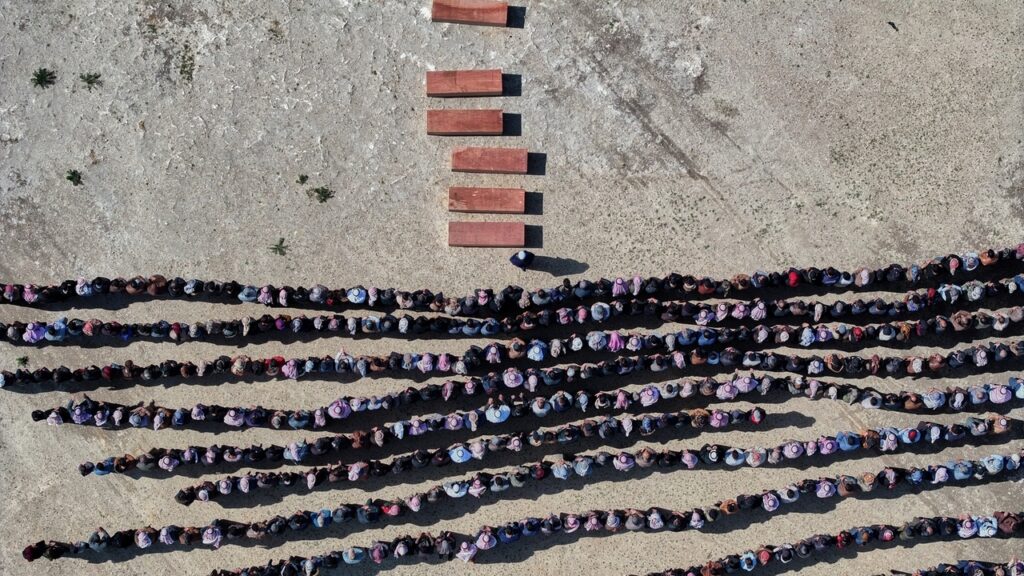A Syrian man buries his wife and 4 children killed in Israeli strikes on Beirut