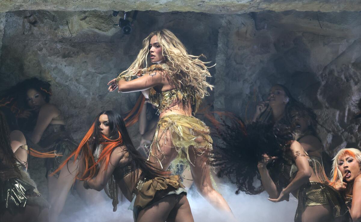 Karol G performs at the Coachella stage on weekend one of the Coachella Valley Music and Arts Festival.