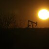 A pumping jack is visible in silhouette against an orange-sky sunrise on Feb. 24, 2025, in Hobbs, New Mexico.