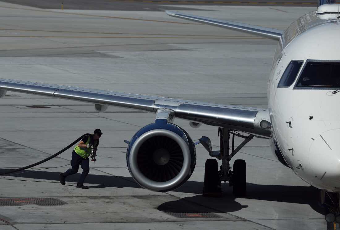 A worker fuels a Delta Airlines plane at Salt Lake City International Airport on April 09, 2026. As fuel prices continue to rise amid the war in Iran, airlines around the world are canceling flights and scaling back routes due to surging jet fuel prices.
