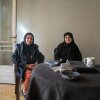 Mariam Allawiya, 60 (left), and Kafa Wehbe, 67, sit together in a vacant apartment building in central Beirut after displaced from southern Lebanon by Israel's current invasion.
