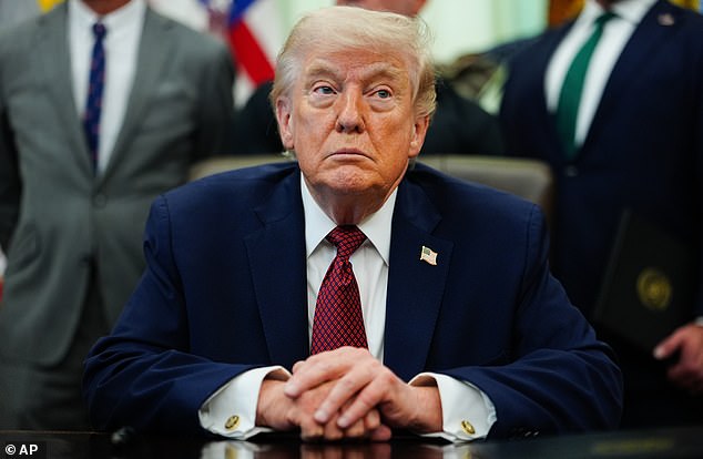 President Donald Trump listens in the Oval Office of the White House, Saturday, April 18, 2026, in Washington. (AP Photo/Julia Demaree Nikhinson)