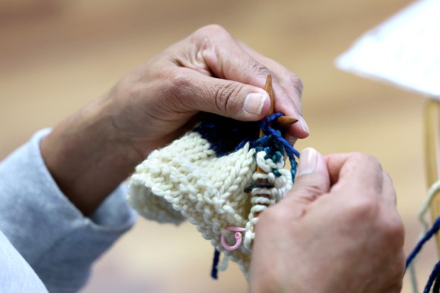 Janice Orrego knits at a drop-in session at Purls of Joy in Healdsburg Thursday, April 16, 2026. (Beth Schlanker / The Press Democrat)
