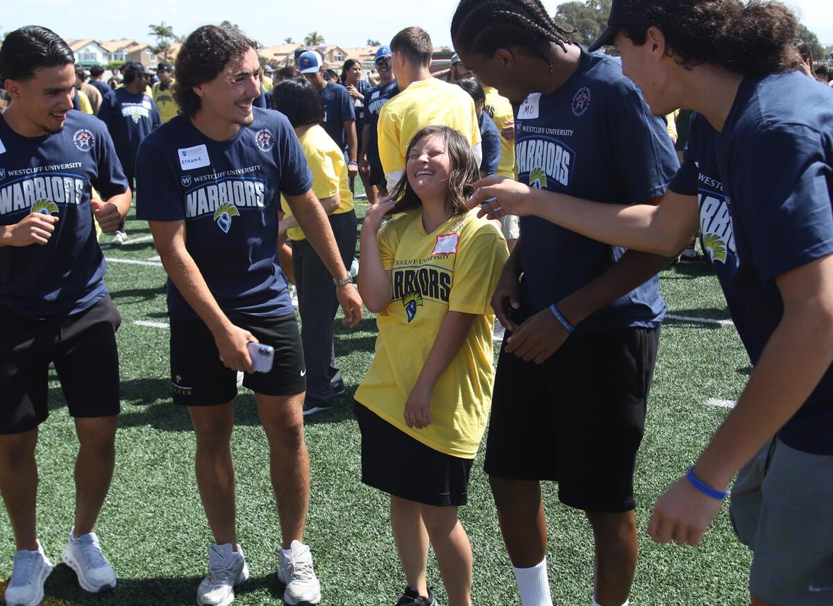 A special education student from the Huntington Beach Union High School District is all smiles on Thursday.
