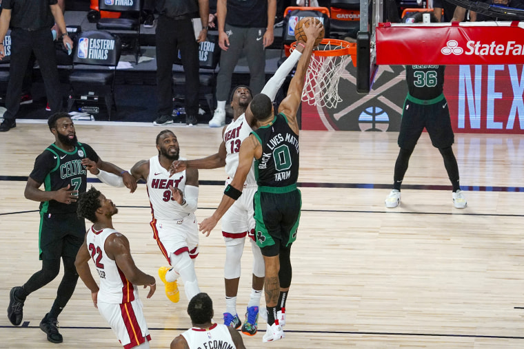 Image: Boston Celtics' Jaylen Brown, Miami Heat's Jimmy Butler and Jae Crowder look on as Bam Adebayo blocks a shot attempt by the Celtics' Jayson Tatum 