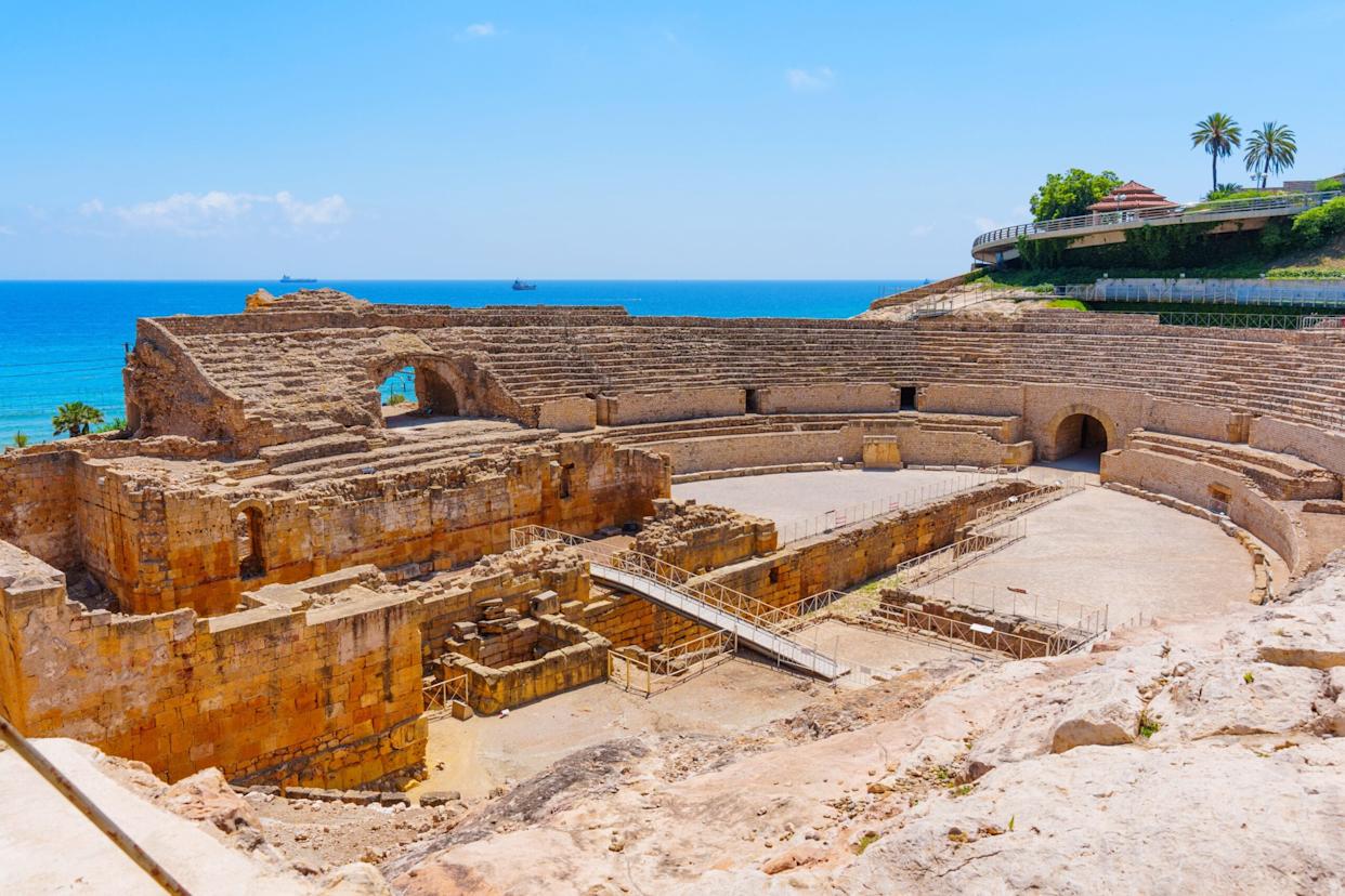 Roman amphitheatre ruins in Tarragona beside the Mediterranean
