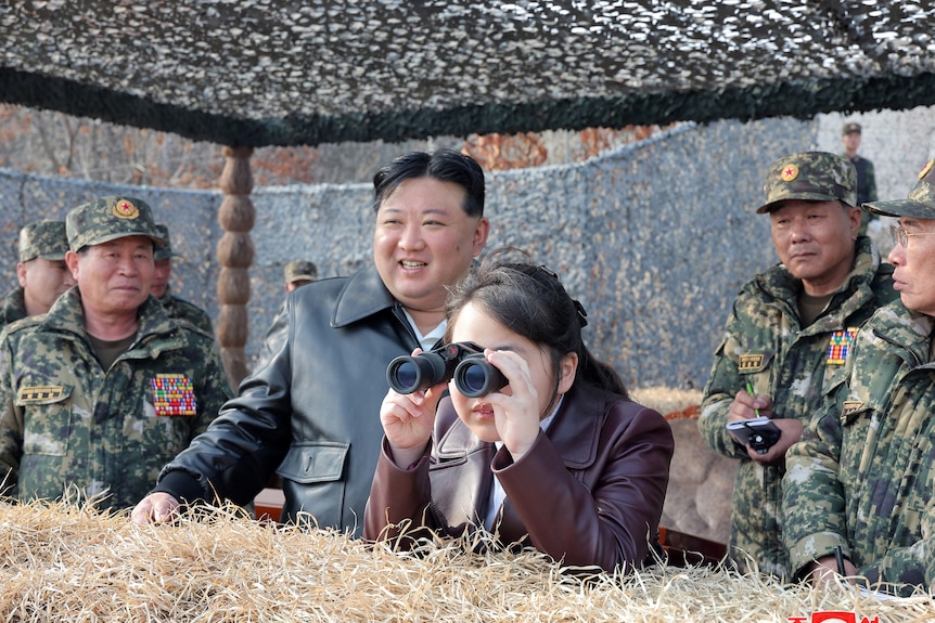 Kim Jong Un and his daughter at a military exercise