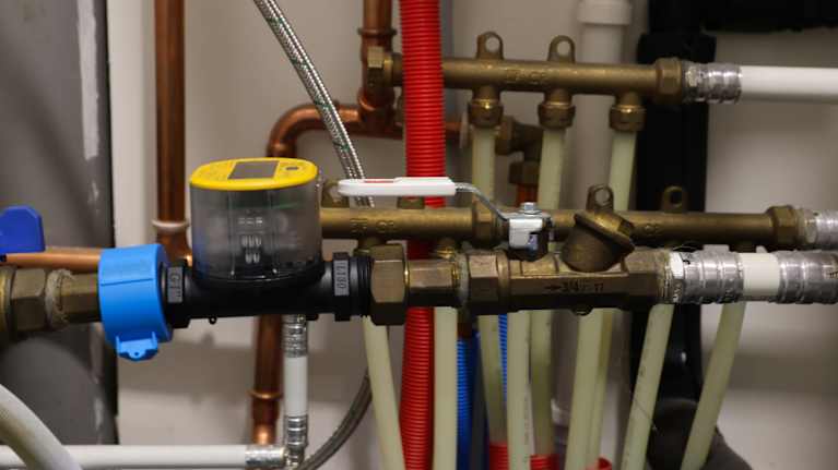 Photo shows water pumps and meter.
